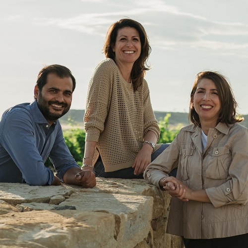 people, group, outdoor, stone wall, smiles