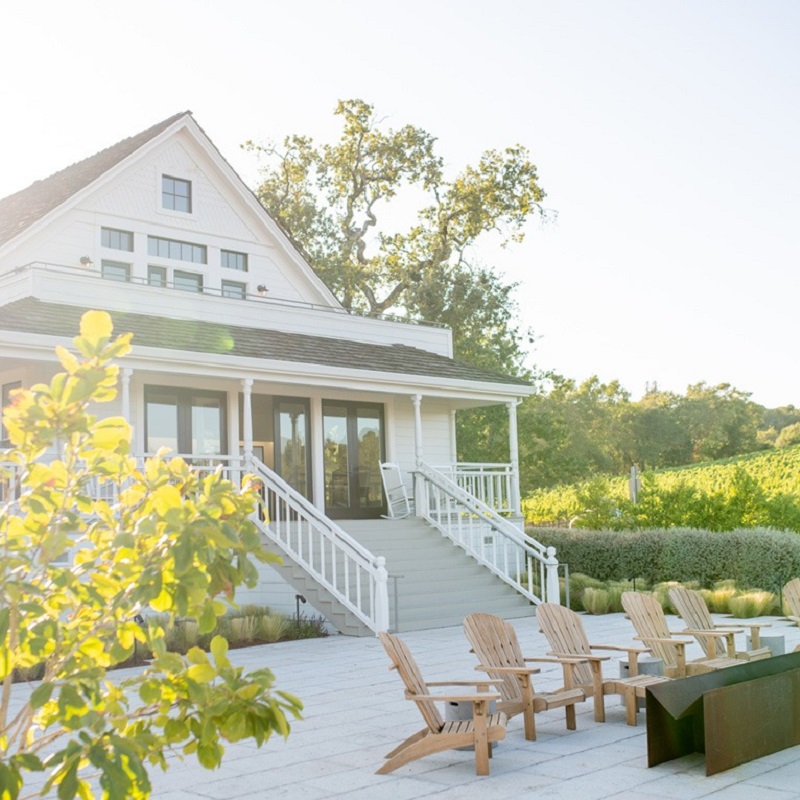 house, vacation home, porch, outdoor seating, adobe?